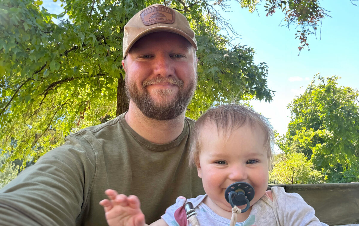 Eric Ross with his infant daughter