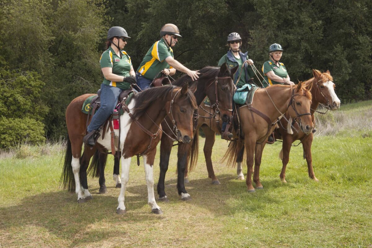 four people on horseback