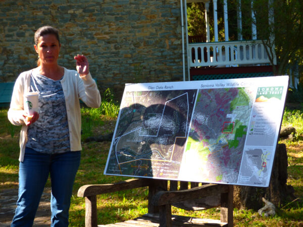 Misti presenting in front of a map.
