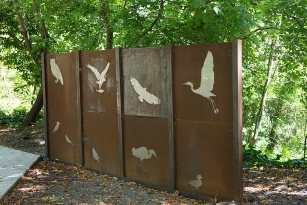 Metal signage with silhouettes of birds