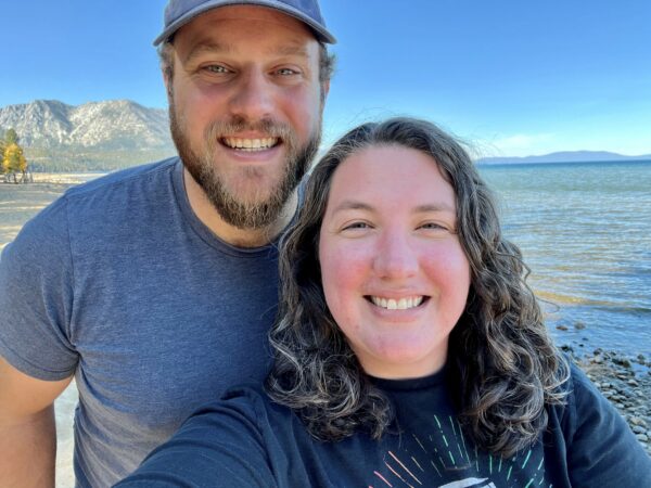 Catherine and a man in front of water