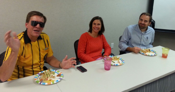 Misti sitting with colleagues at a table